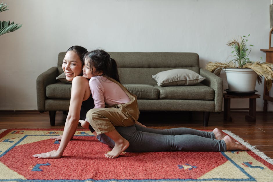 A joyful mother practicing yoga with her daughter on a colorful rug indoors. practice gratitude