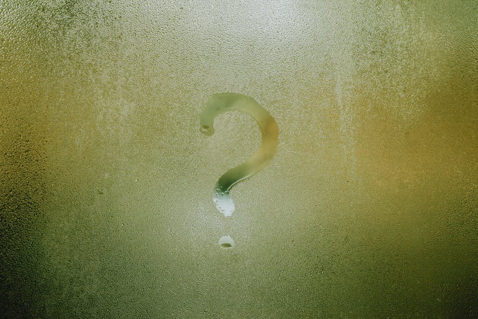 A question mark drawn on foggy glass, evoking curiosity and mystery. Conscious choices